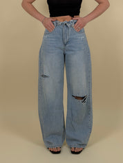 Jeans con strappi e risvolto lavaggio chiaro
