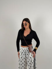 Maglia manica lunga semivelata con scollo a V