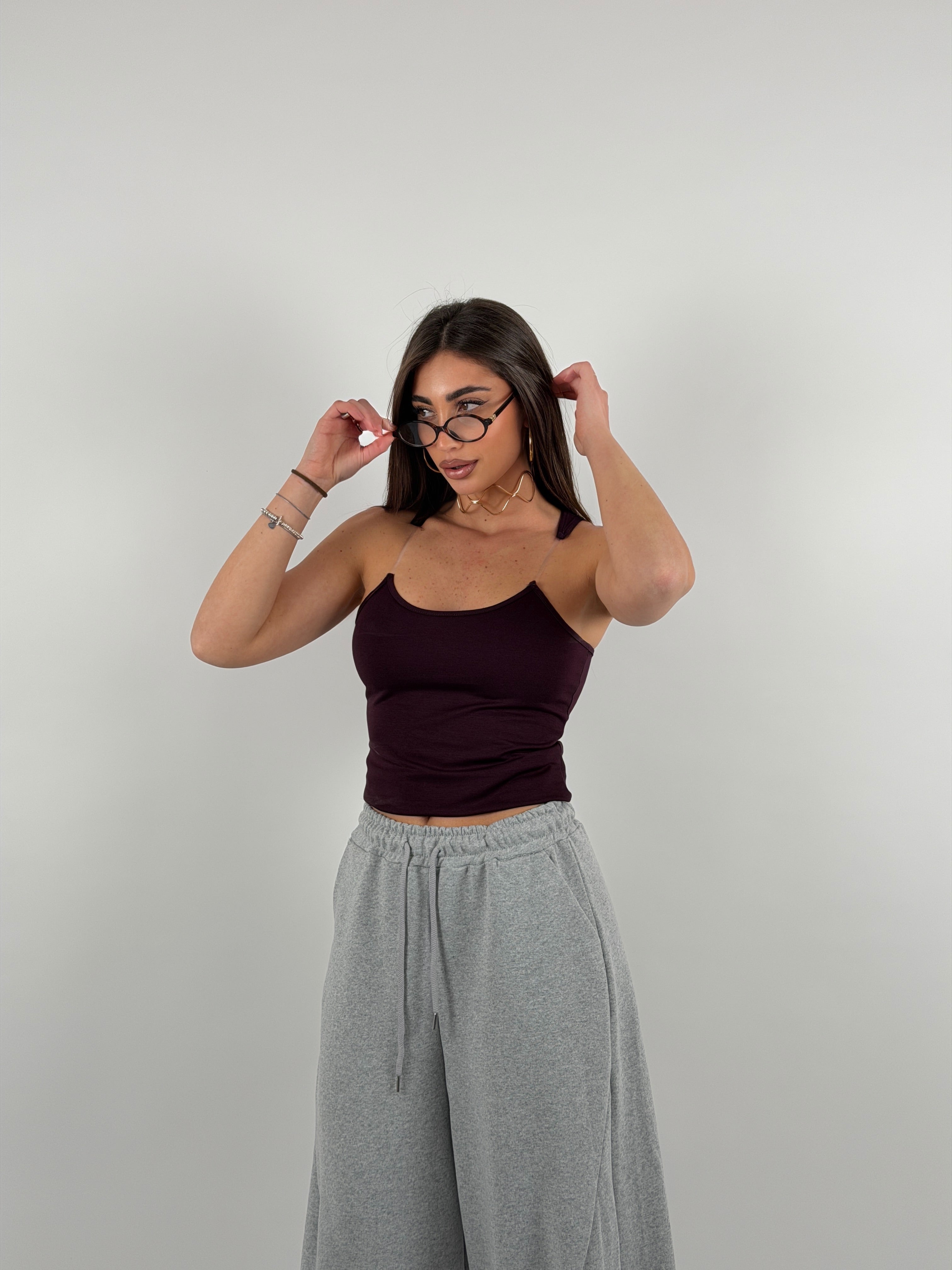 Top con bretelline in silicone trasparente, tessuto a costine strette