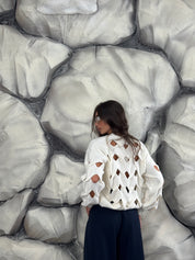 Maglione con aperture