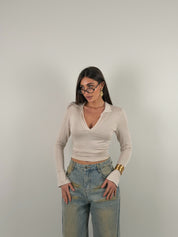 Maglia manica lunga semivelata con scollo a V