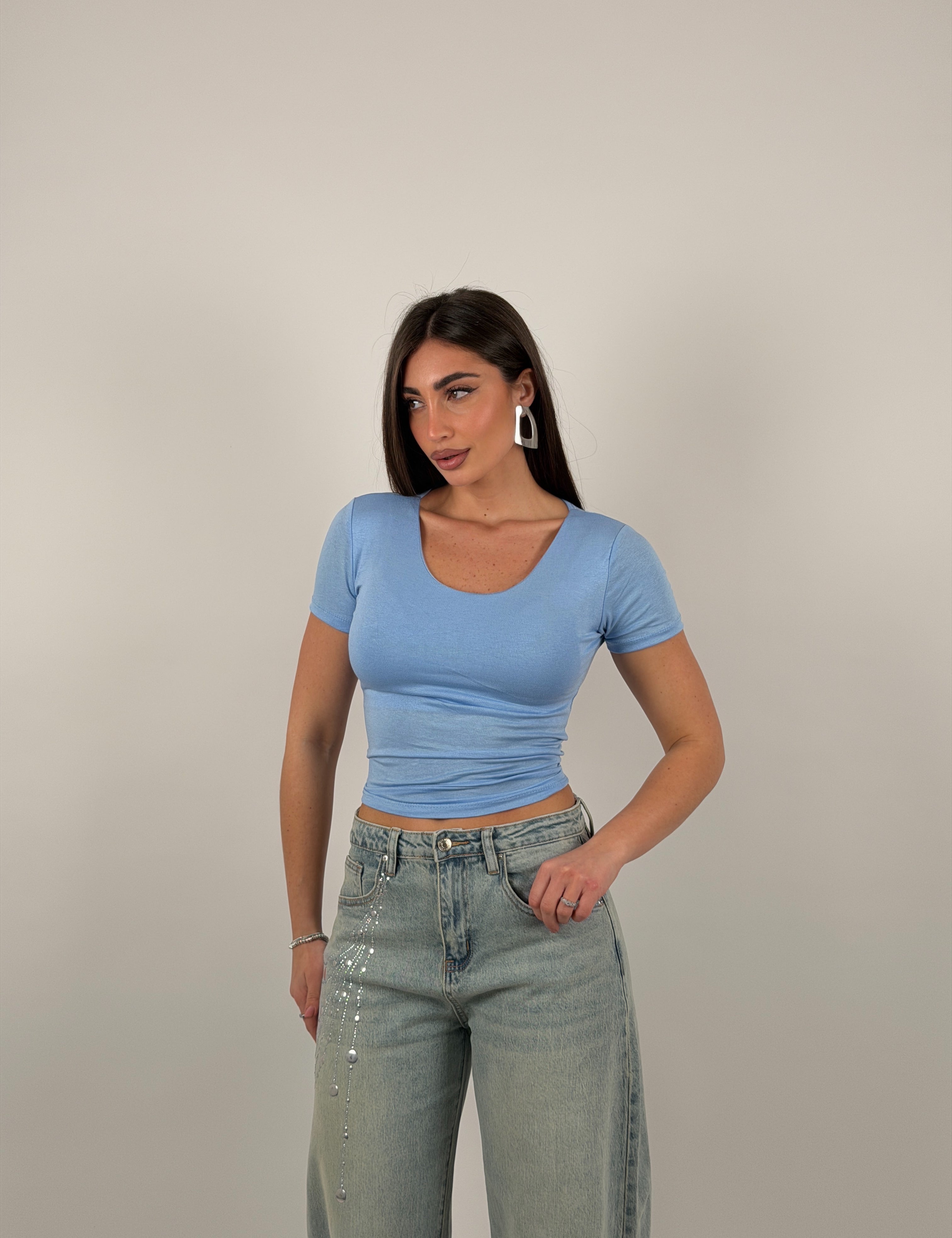 Maglia semivelata con scollo tondo e mezza manica