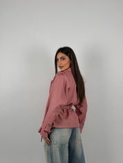 Giacca foderata modello trench in ecopelle con cintura in vita