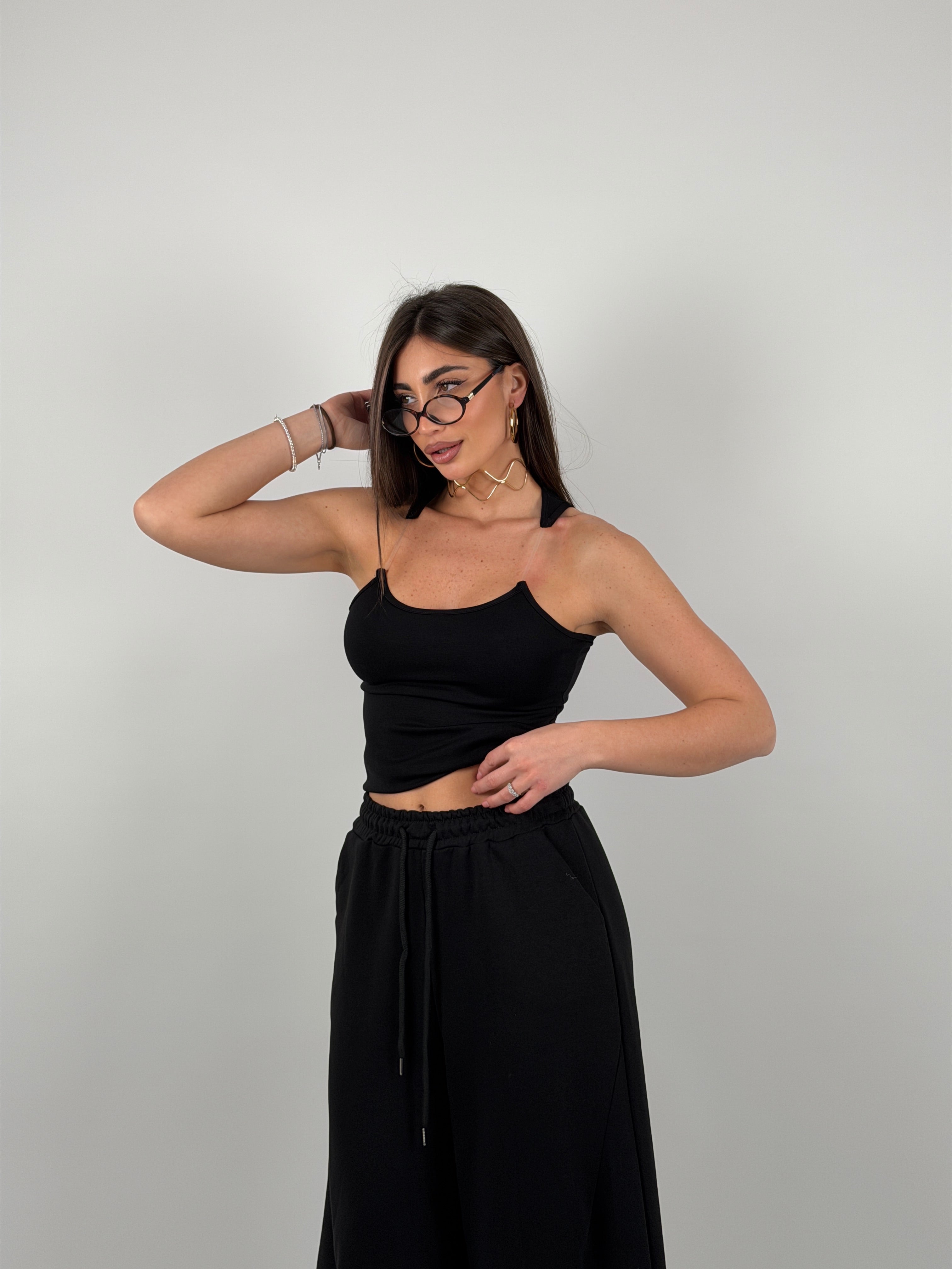 Top con bretelline in silicone trasparente, tessuto a costine strette