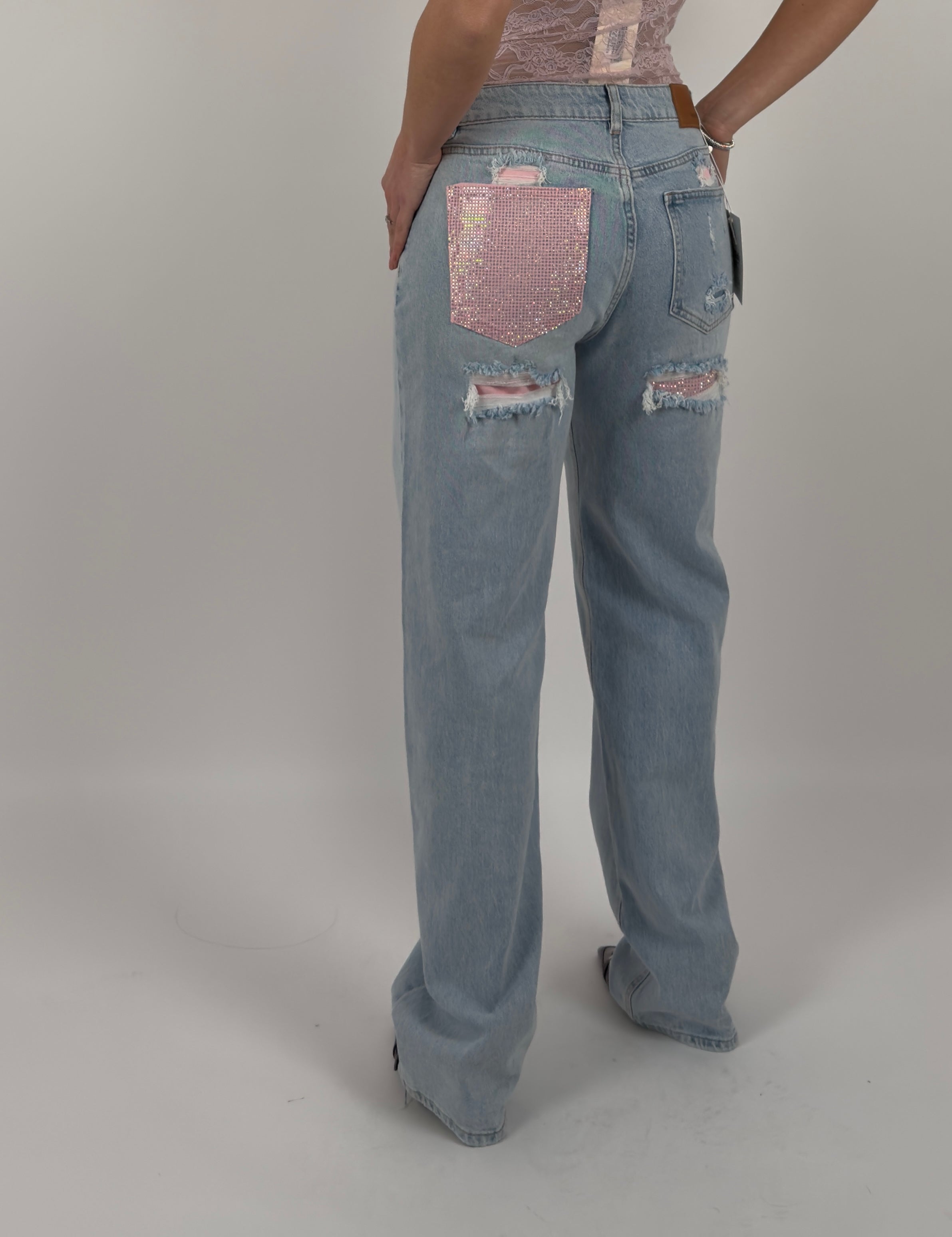 Jeans con tasca brillantinata