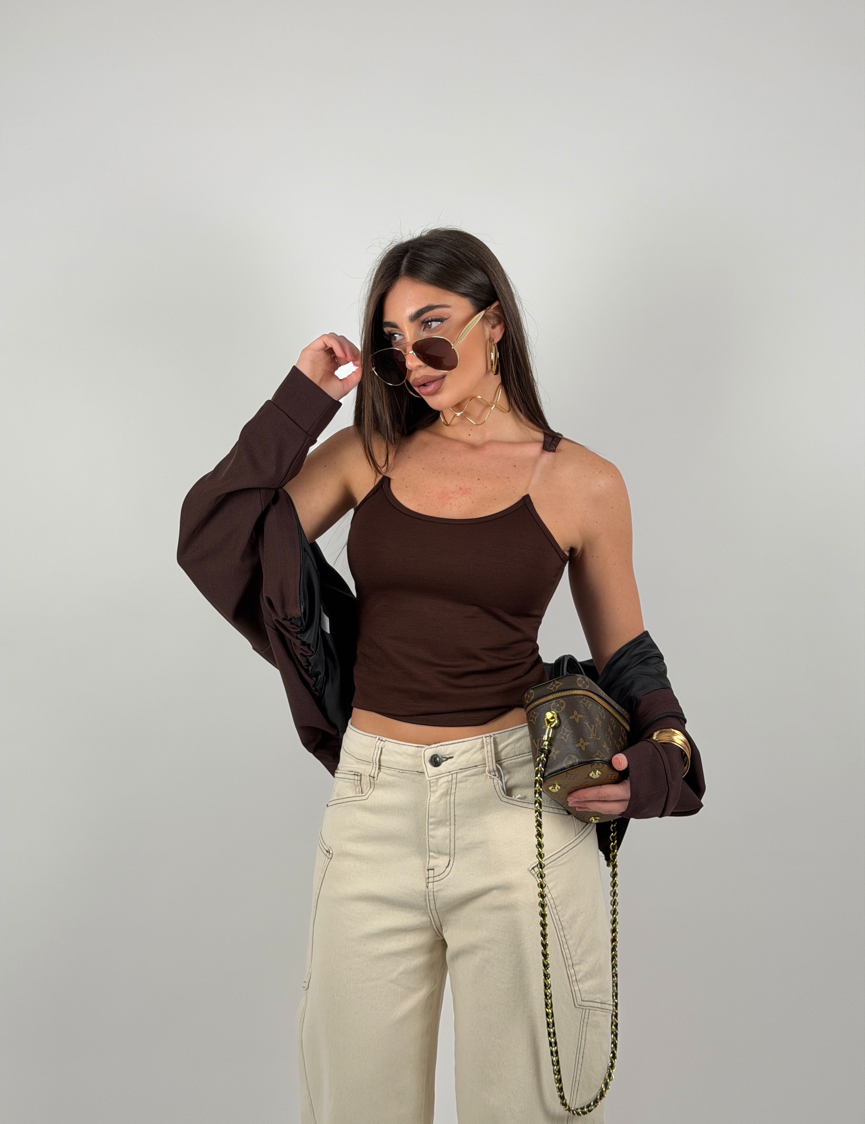 Top con bretelline in silicone trasparente, tessuto a costine strette