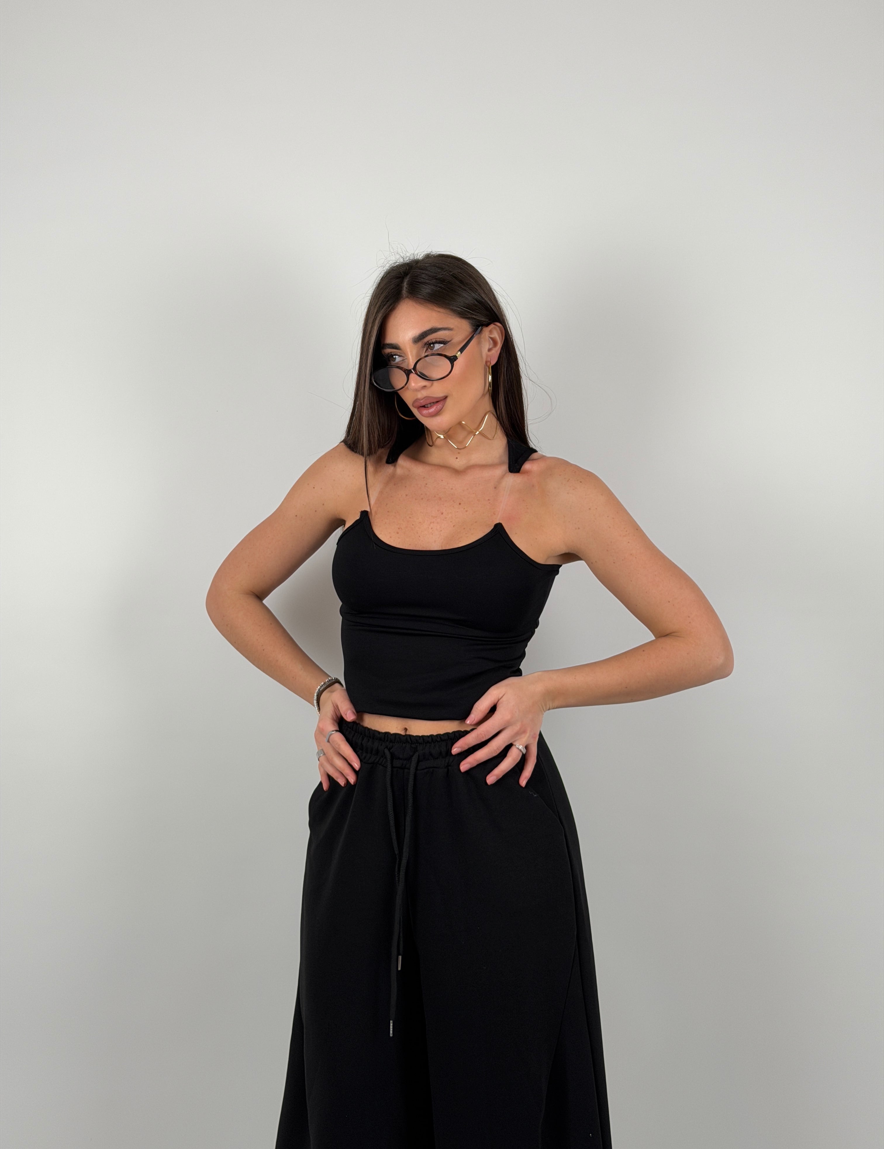 Top con bretelline in silicone trasparente, tessuto a costine strette