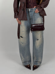 Jeans lavaggio sabbiato con strappi sul davanti