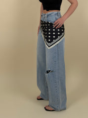Jeans con strappi e risvolto lavaggio chiaro